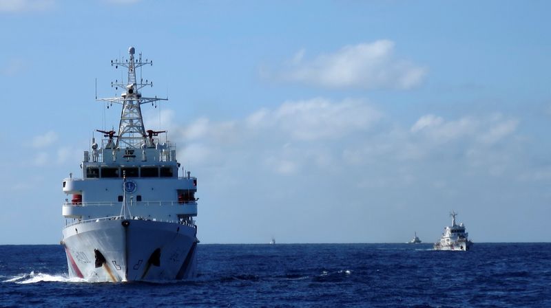 FILE PHOTO: Chinese coastguard ships give chase to Vietnamese coastguard