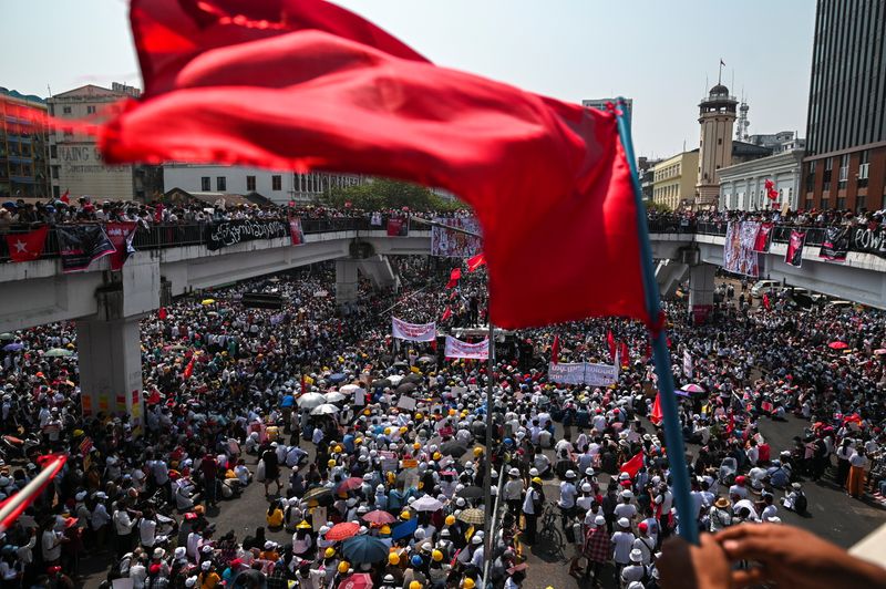 Demonstrators protest a against military coup in Yangon