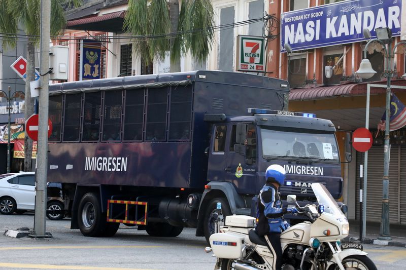 An immigration truck carrying Myanmar migrants to be deported from