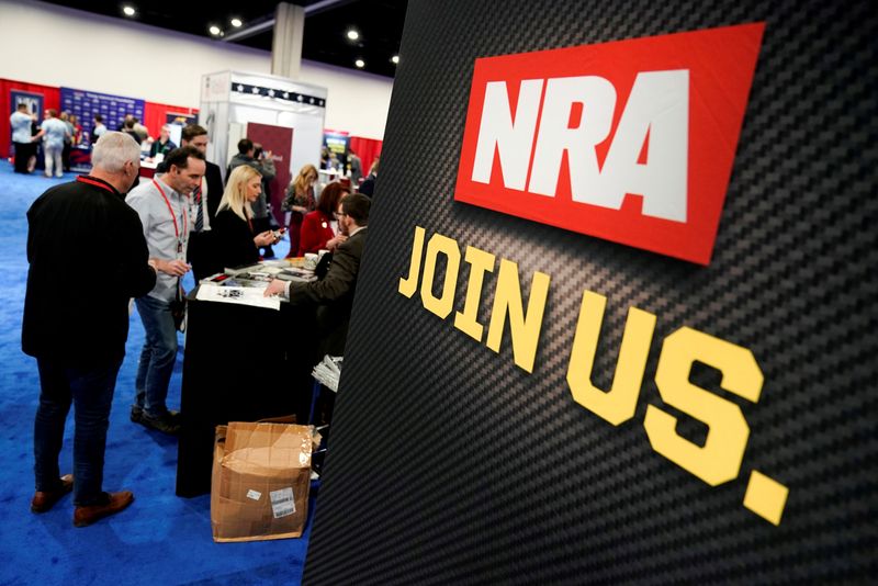 FILE PHOTO: Attendees sign up at the National Rifle Association