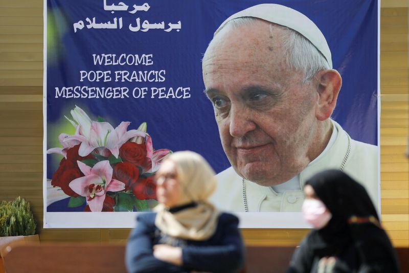 A poster of Pope Francis is seen ahead of his