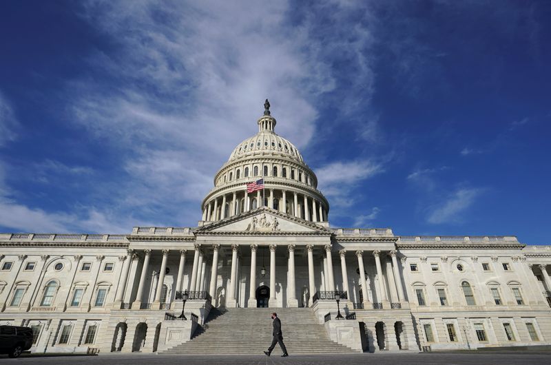 A man walks past the U.S. Capitol in Washington