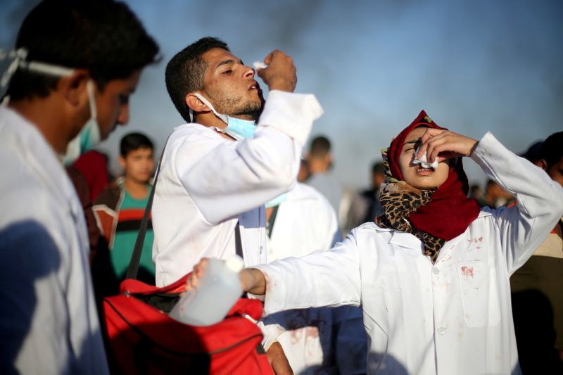 FILE PHOTO: Female Palestinian medic Razan Al-Najar works at the