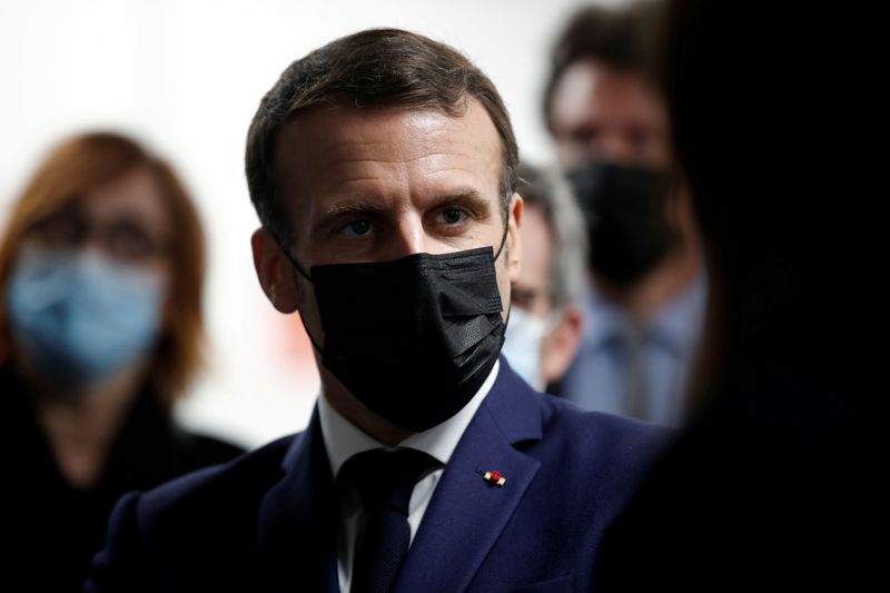 FILE PHOTO: French President Macron visits a coronavirus disease (COVID-19)