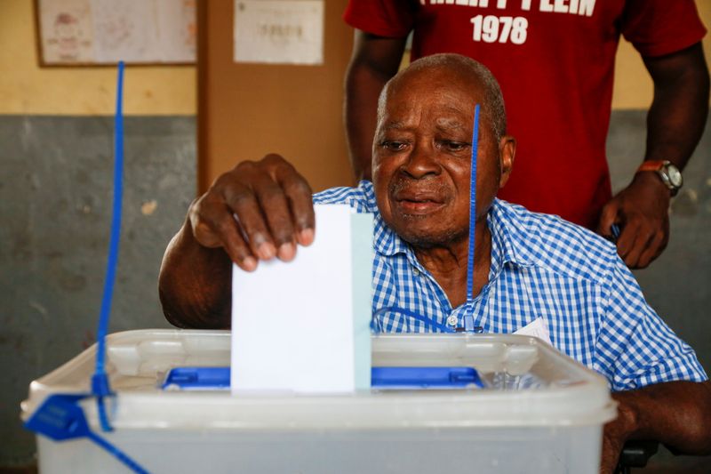 A man casts his ballot at a polling station during