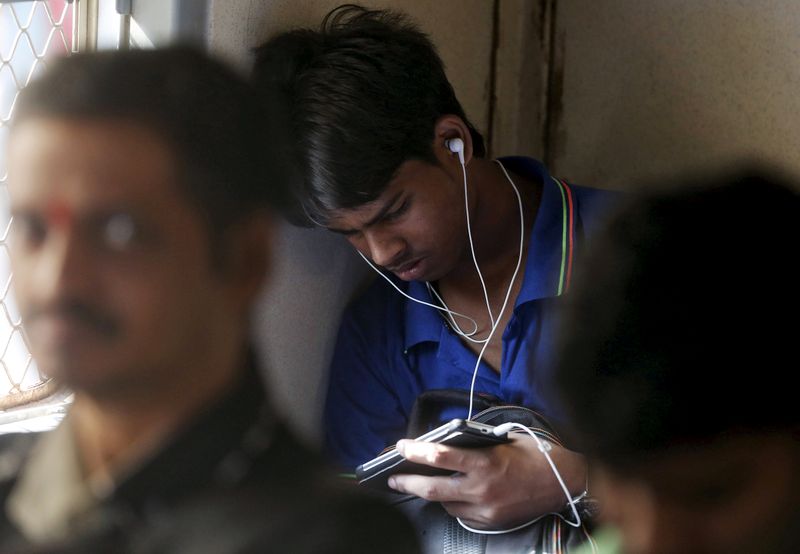 FILE PHOTO: A man watches a video on his mobile