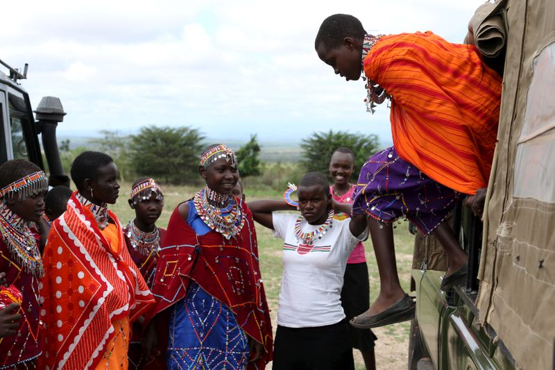 FILE PHOTO: Maasai girls arrive for the start of a