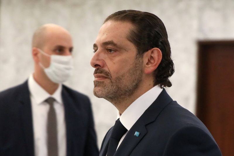 Prime Minister-designate Saad al-Hariri walks after meeting with Lebanon’s President