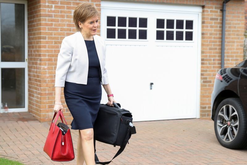 FILE PHOTO: Scotland’s First Minister Sturgeon leaves her home in