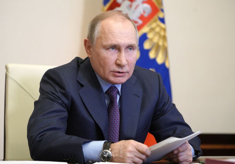 Russian President Vladimir Putin speaks during a video conference call
