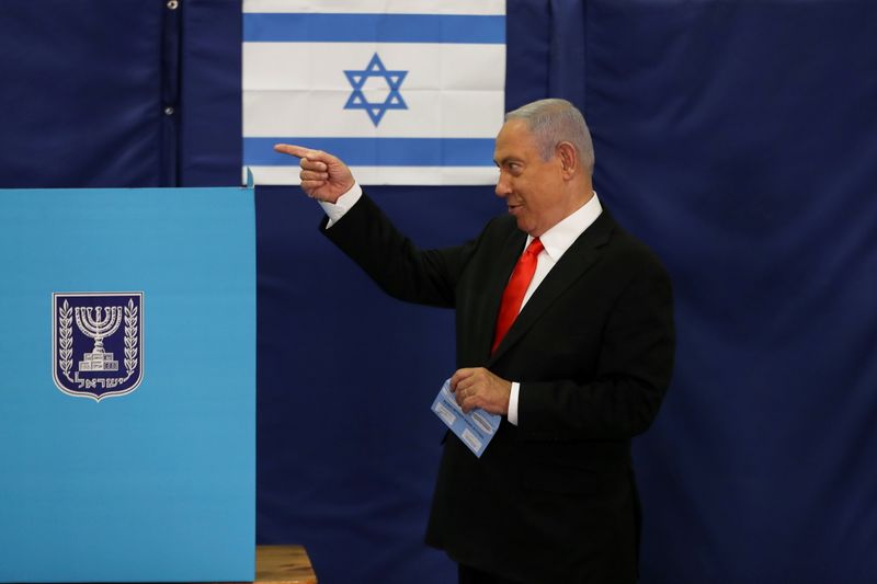 FILE PHOTO: Israeli Prime Minister Benjamin Netanyahu gestures while standing