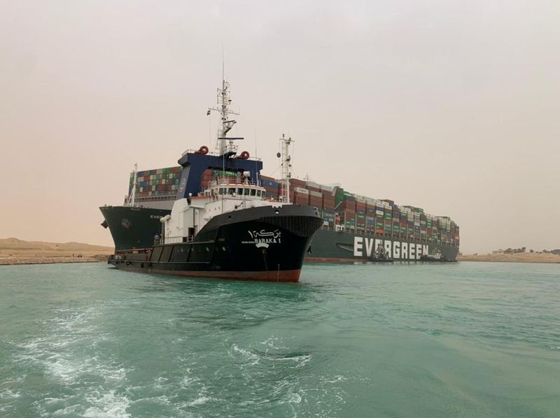 Container ship runs aground in Suez Canal, blocks traffic