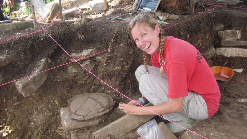 Archeologist Amy Thompson excavates at the ancient Maya site of