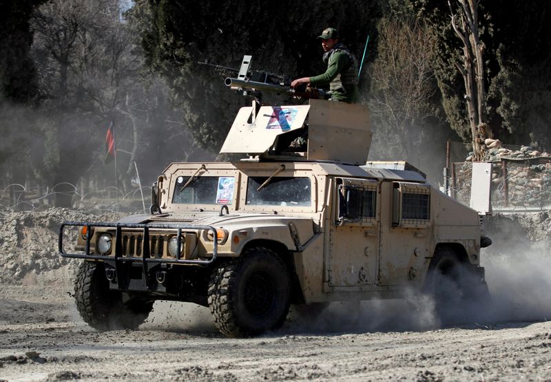 FILE PHOTO: An armoured vehicle patrols near the side of