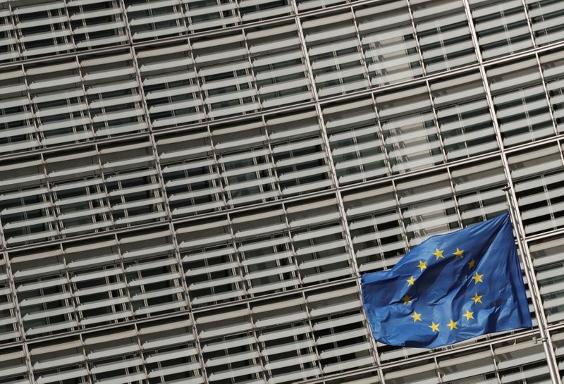 FILE PHOTO: European Union flags flutter outside the European Commission