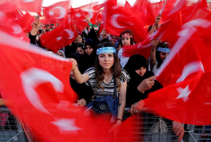 FILE PHOTO: Supporters of Turkish President Erdogan wave national flags