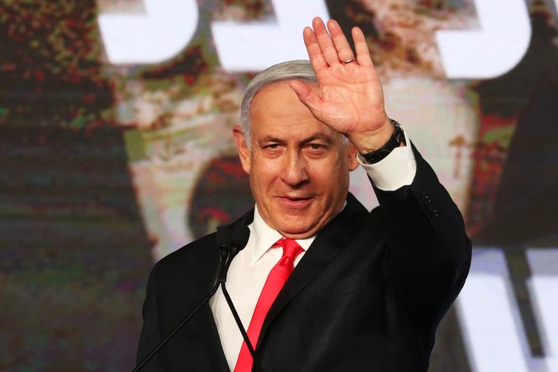 Israeli Prime Minister Benjamin Netanyahu gestures as he delivers a