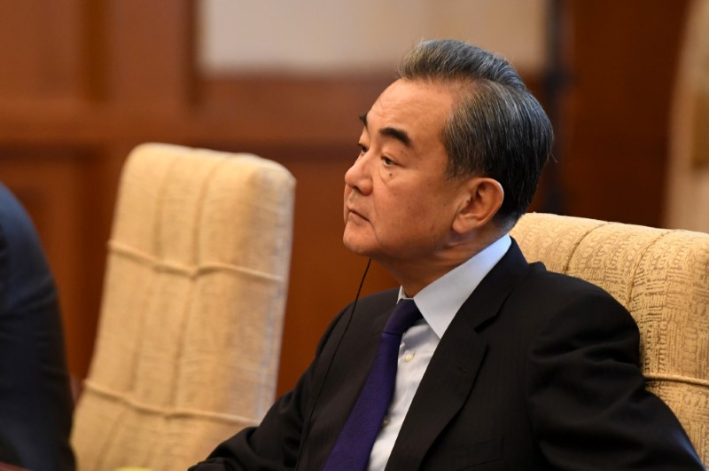 China’s Foreign Minister Wang Yi listens to Iran’s Foreign Minister