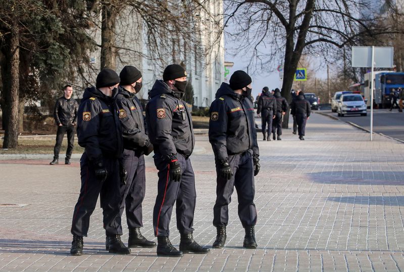 FILE PHOTO: Belarusian law enforcement officers stand guard in a
