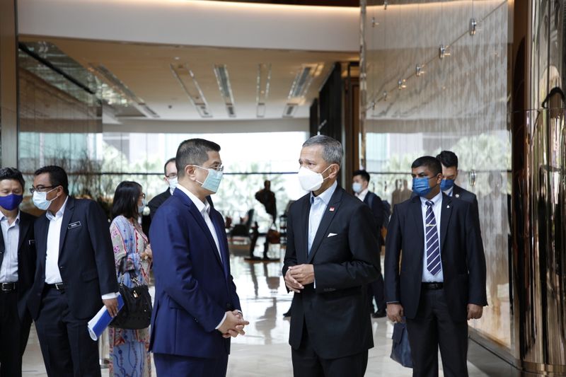 Singapore’s Minister for Foreign Affairs Dr Vivian Balakrishnan speaks with