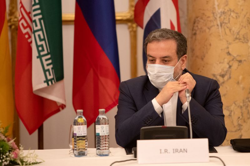 FILE PHOTO: Iran’s top nuclear negotiator Araqchi and EEAS Schmid