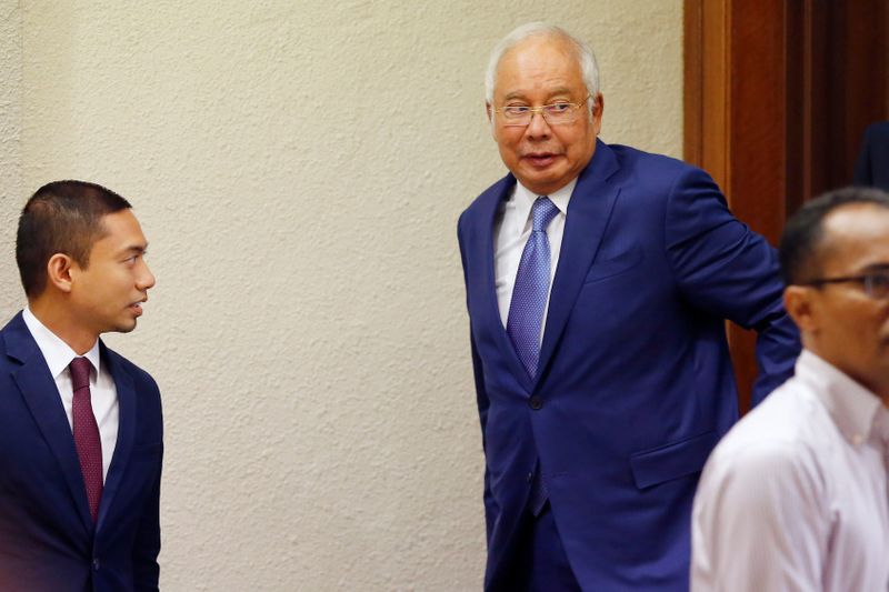 Former Malaysian Prime Minister Najib Razak walks out of a