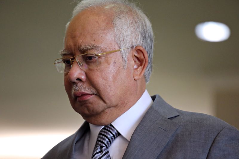 FILE PHOTO: Former Malaysian Prime Minister Najib Razak reacts during
