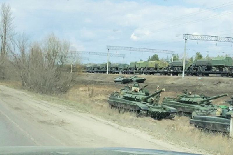 A still image from video shows tanks and military vehicles
