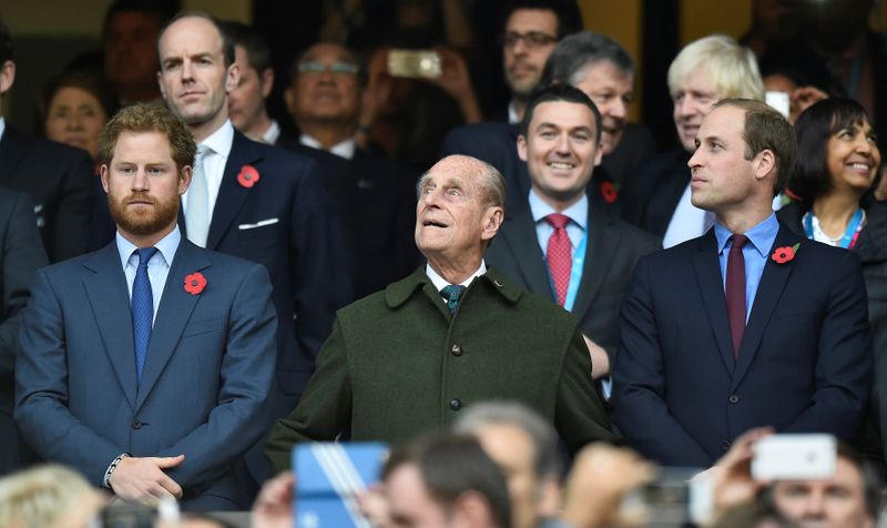 FILE PHOTO: Britain’s Prince Harry, Prince Philip and Prince William