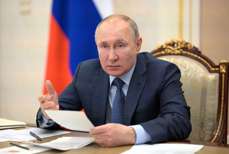 FILE PHOTO: Russian President Putin chairs a meeting with senior