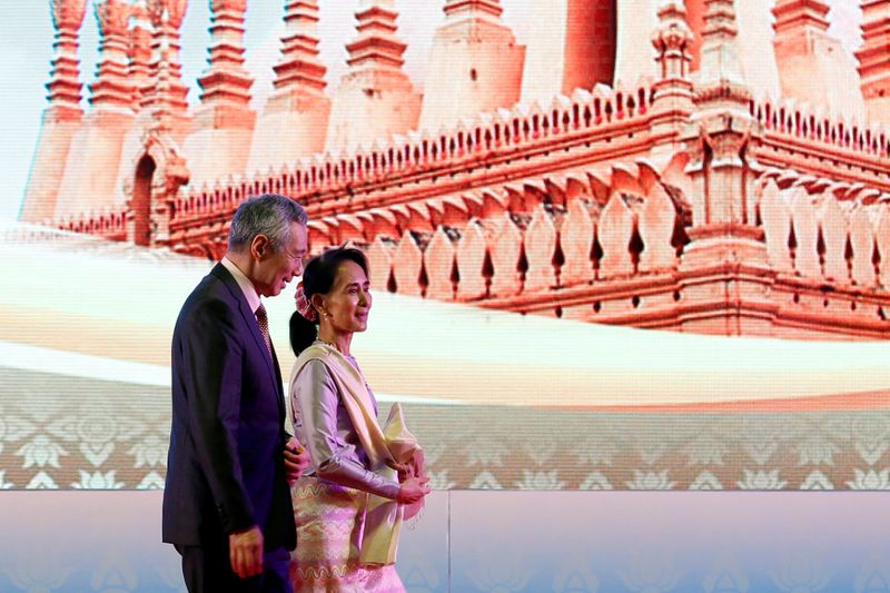 FILE PHOTO: Myanmar leader Aung San Suu Kyi and Singapore’s
