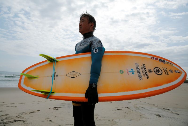 Koji Suzuki, a surfer and a surf shop owner, by