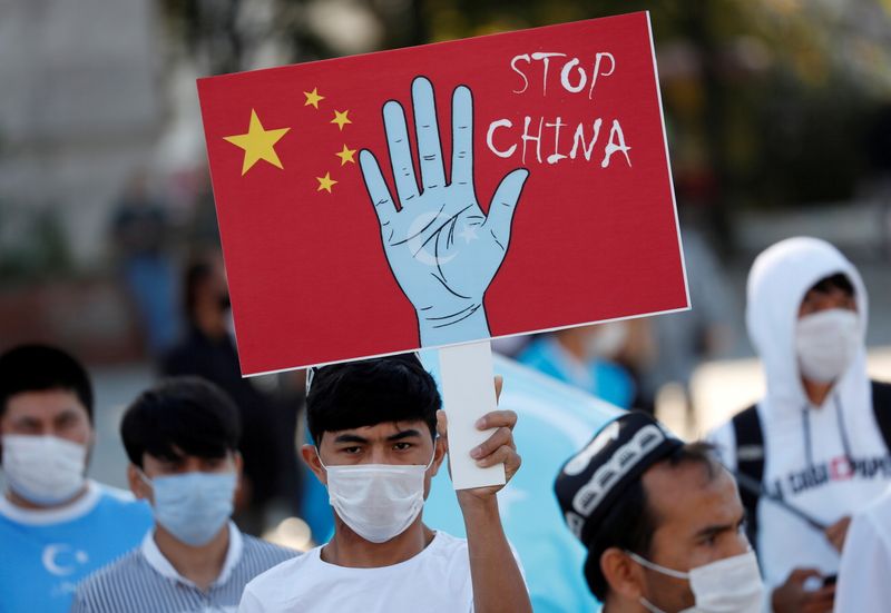 FILE PHOTO: Ethnic Uighur demonstrators take part in a protest