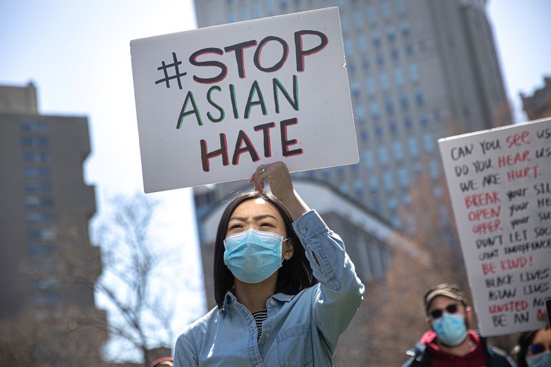 People participate in a Stop Asian Hate rally at Columbus