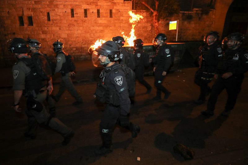 Palestinians clash with Israeli police during the Muslim holy fasting