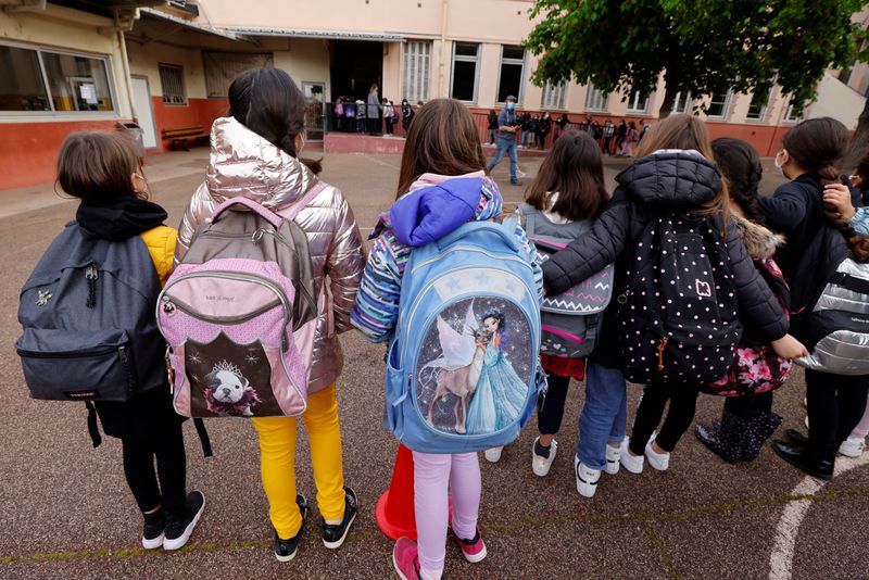 French schoolchildren return to classes under strict sanitary measures