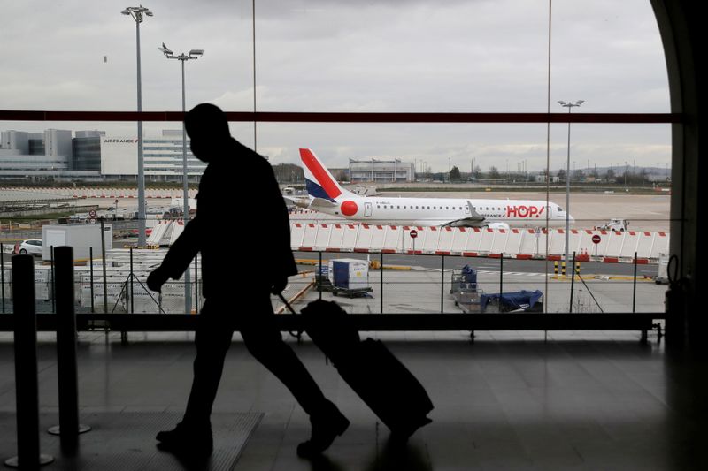 FILE PHOTO: A man walks through a terminal at Paris