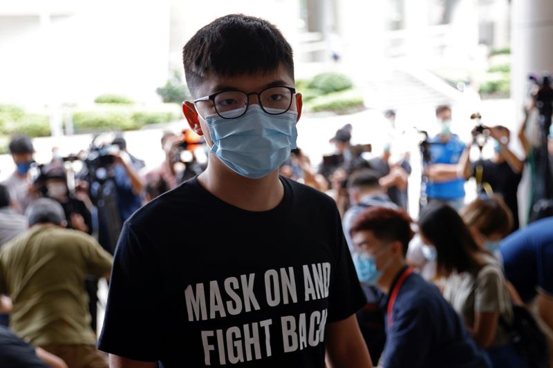 Pro-democracy activist Joshua Wong arrives at the Eastern Magistrates’ Courts