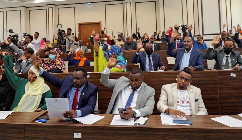 Somalia legislators vote by rising their hands to cancel a