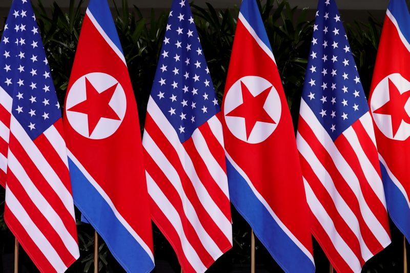 FILE PHOTO: U.S. and North Korean national flags are seen