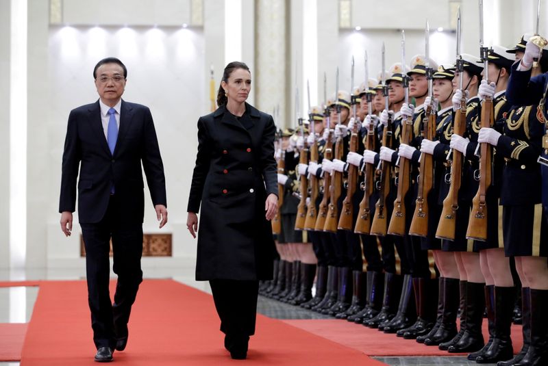 FILE PHOTO: Jacinda Ardern and China’s Premier Li Keqiang attend