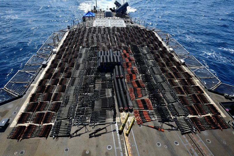 Thousands of illicit weapons are displayed onboard the guided-missile cruiser