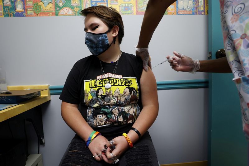 Grace Peterson, 14, is inoculated with Pfizer’s vaccine against coronavirus