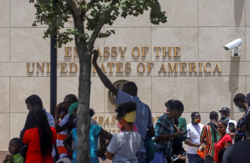 Haitians gather outside the U.S. Embassy after the assassination of