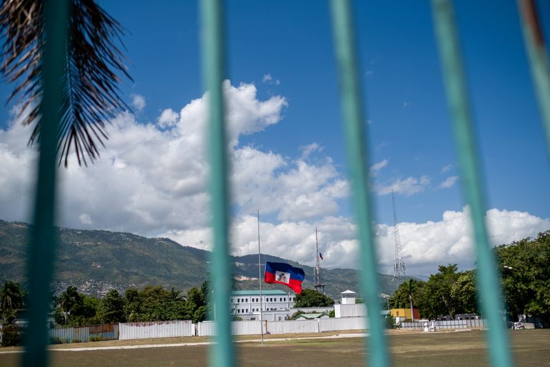 FILE PHOTO: The Haitian national flag waves at half-mast where