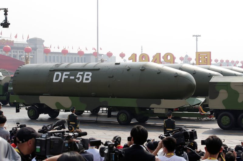 FILE PHOTO: Military vehicles carrying DF-5B intercontinental ballistic missiles travel