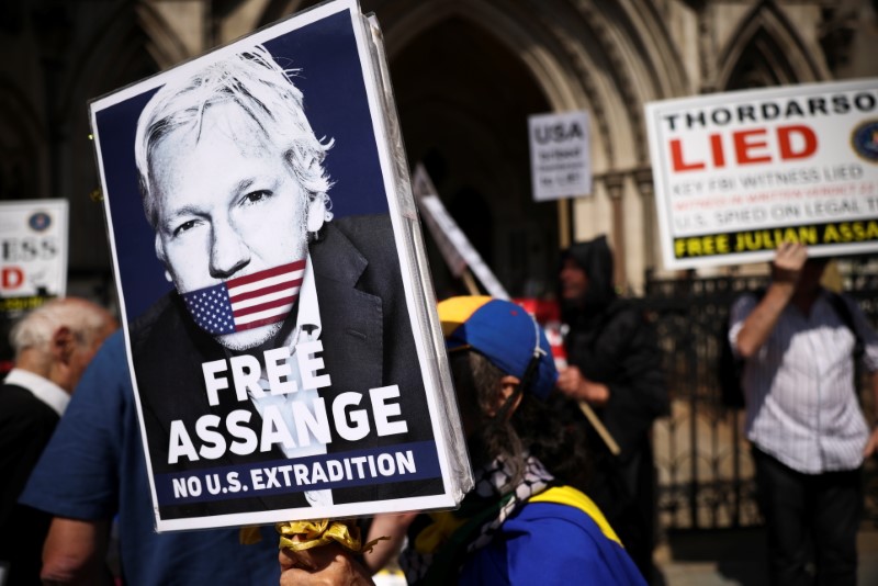 Julian Assange appears at the Royal Courts of Justice in