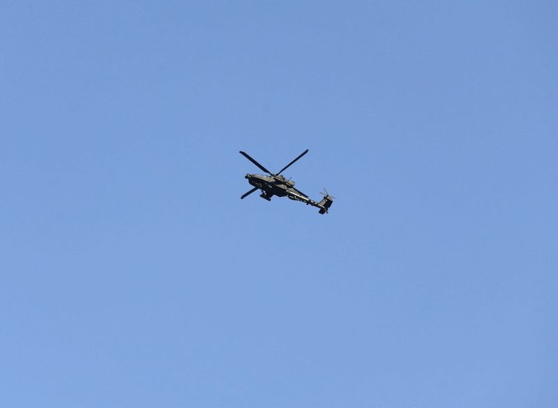 Military helicopter flies over Kabul