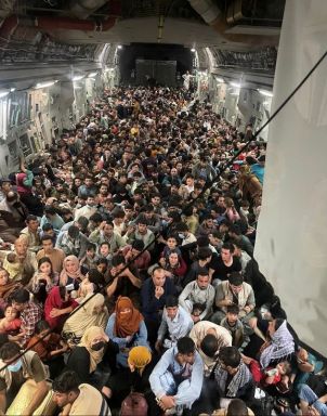 Evacuees crowd the interior of a U.S. Air Force C-17