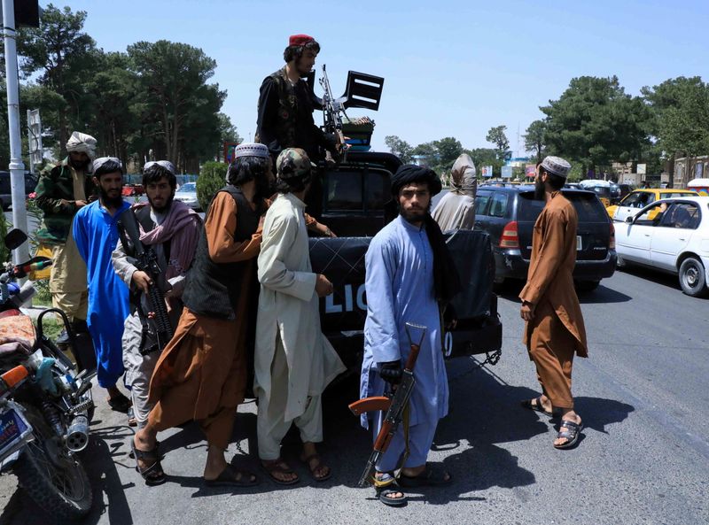 FILE PHOTO: Taliban forces patrol a street in Herat